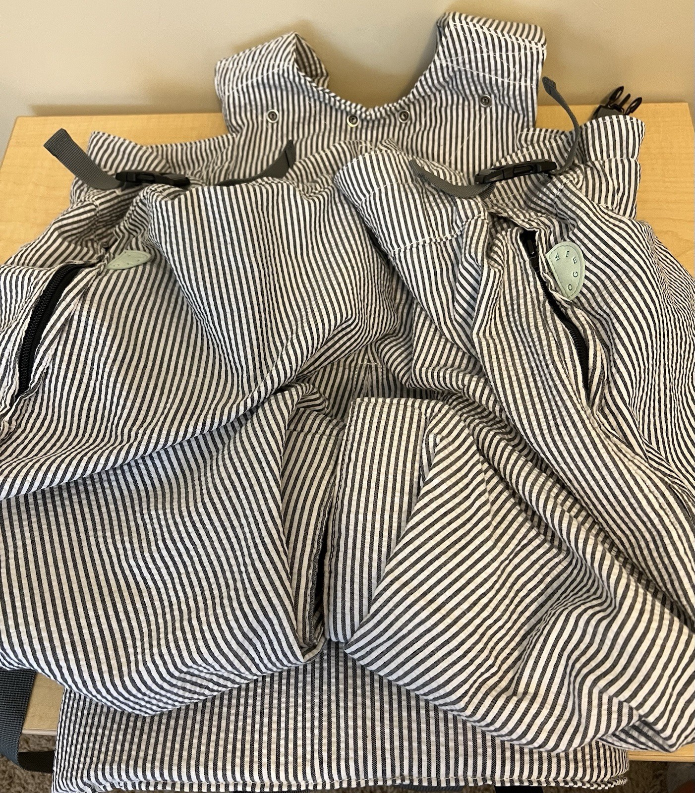 A pre-owned striped Weego TWIN carrier